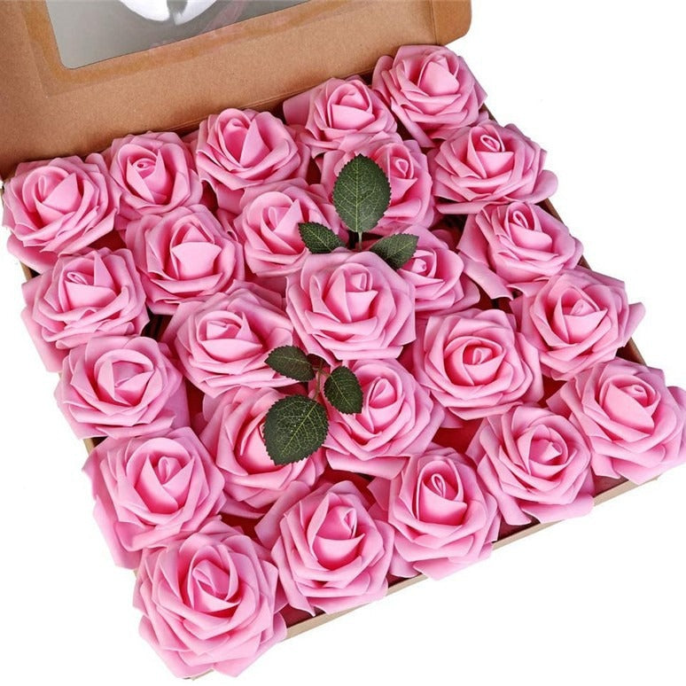 Box filled with pink artificial roses on a white background