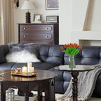 Living room with a dark gray sofa, wooden coffee table, and decorative items.
