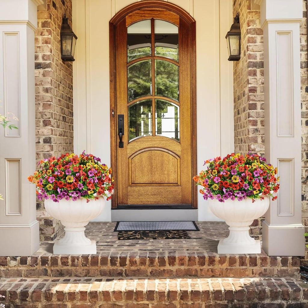 Wooden front door with floral planters on a brick porch
