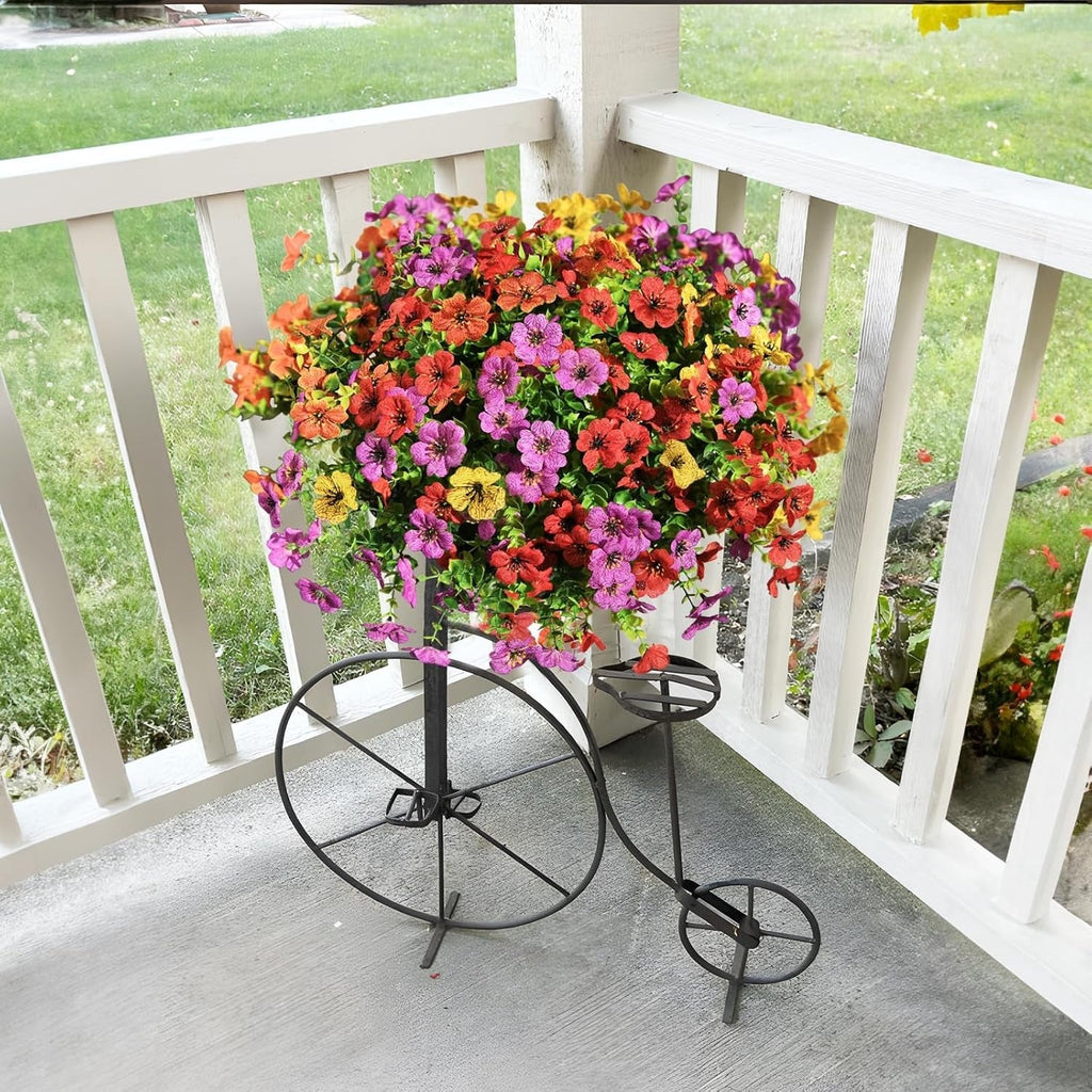 Colorful flower arrangement on a decorative stand on a porch