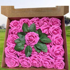 Box of pink roses with green leaves on a grassy background
