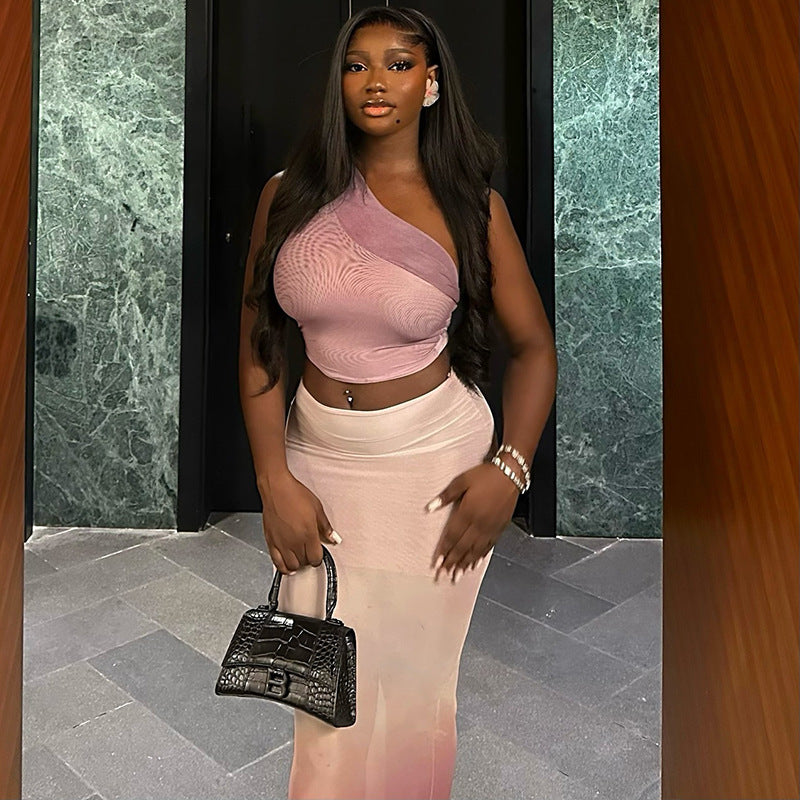 Fresh and fashionable women's clothing with exposed navel and hip-wrapped tight gradient skirt suit with oblique collar and slightly transparent long skirt two-piece suit