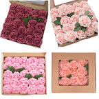 Four boxes containing pink and red artificial roses with green stems.