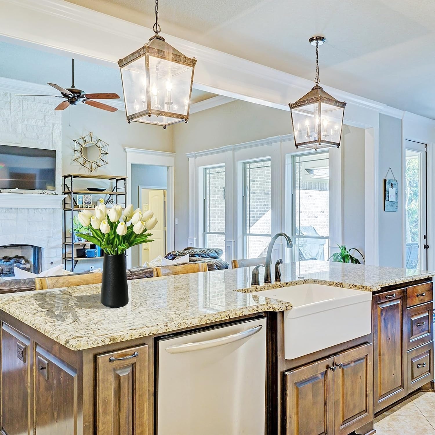 Modern kitchen with wooden cabinets, granite countertops, and a vase of flowers.