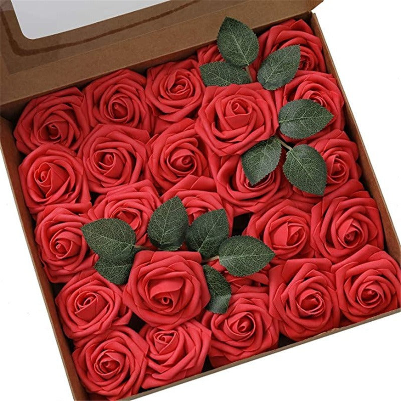Box of red roses with green leaves on a white background