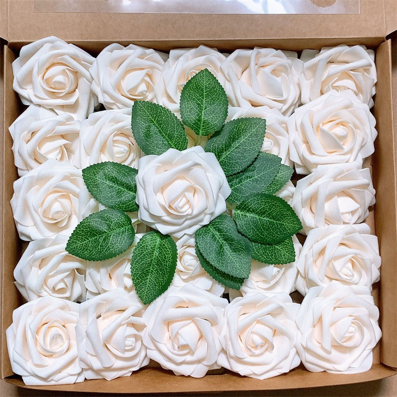 Box of white foam roses with green leaves