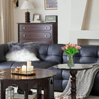 Living room with a dark gray sofa, wooden coffee table, and decorative items.