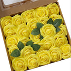 Box of yellow roses with green leaves on a white background