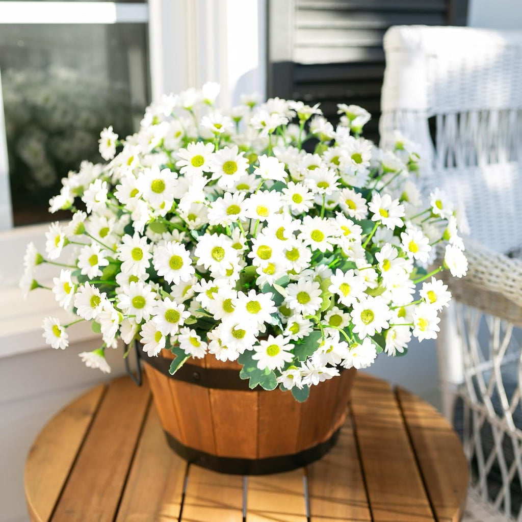Bouquet of white flowers with green centers in a wooden basket on a wooden surface.