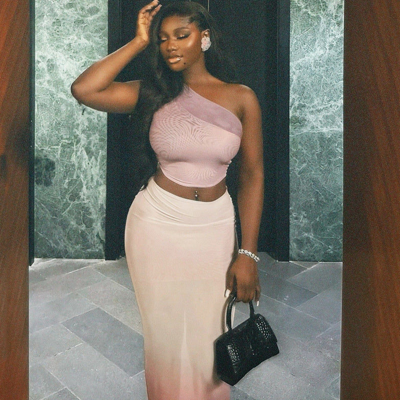 Fresh and fashionable women's clothing with exposed navel and hip-wrapped tight gradient skirt suit with oblique collar and slightly transparent long skirt two-piece suit