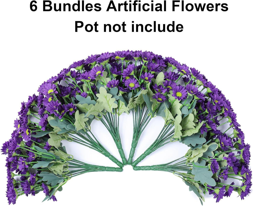 Bouquet of artificial purple flowers with green leaves on a white background