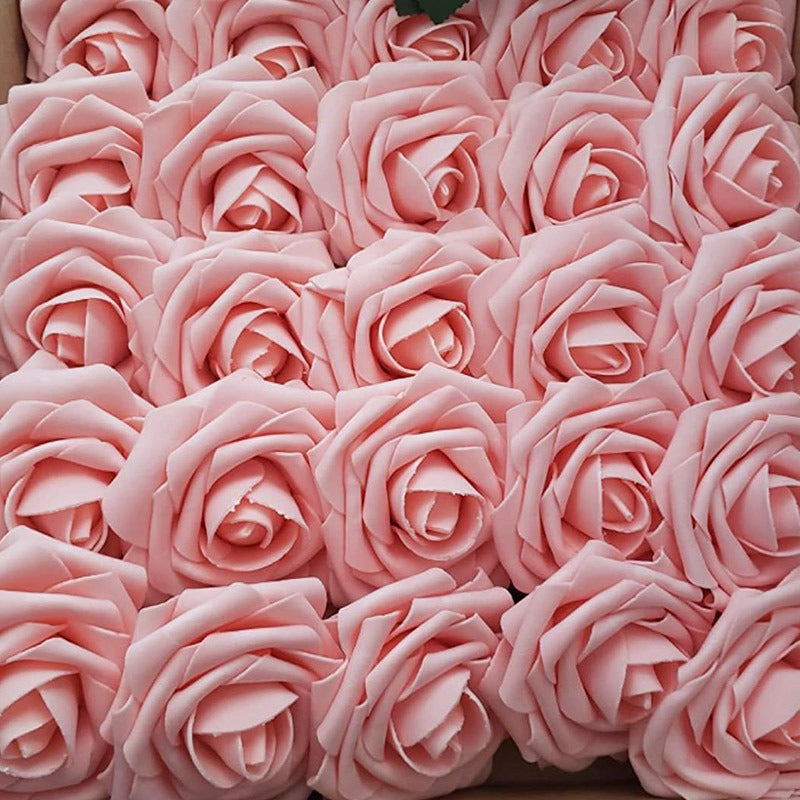 Close-up of pink artificial roses arranged in a pattern