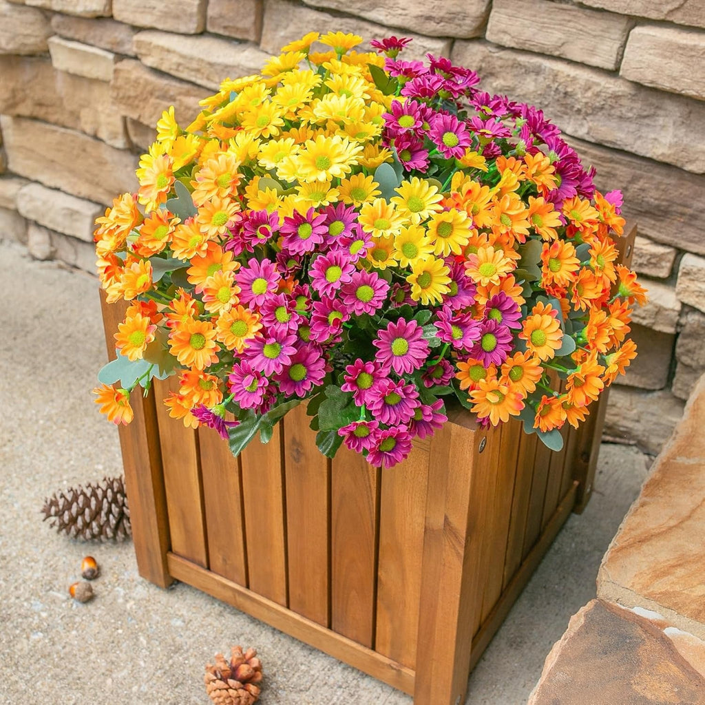Wooden planter with colorful flowers against a stone wall background