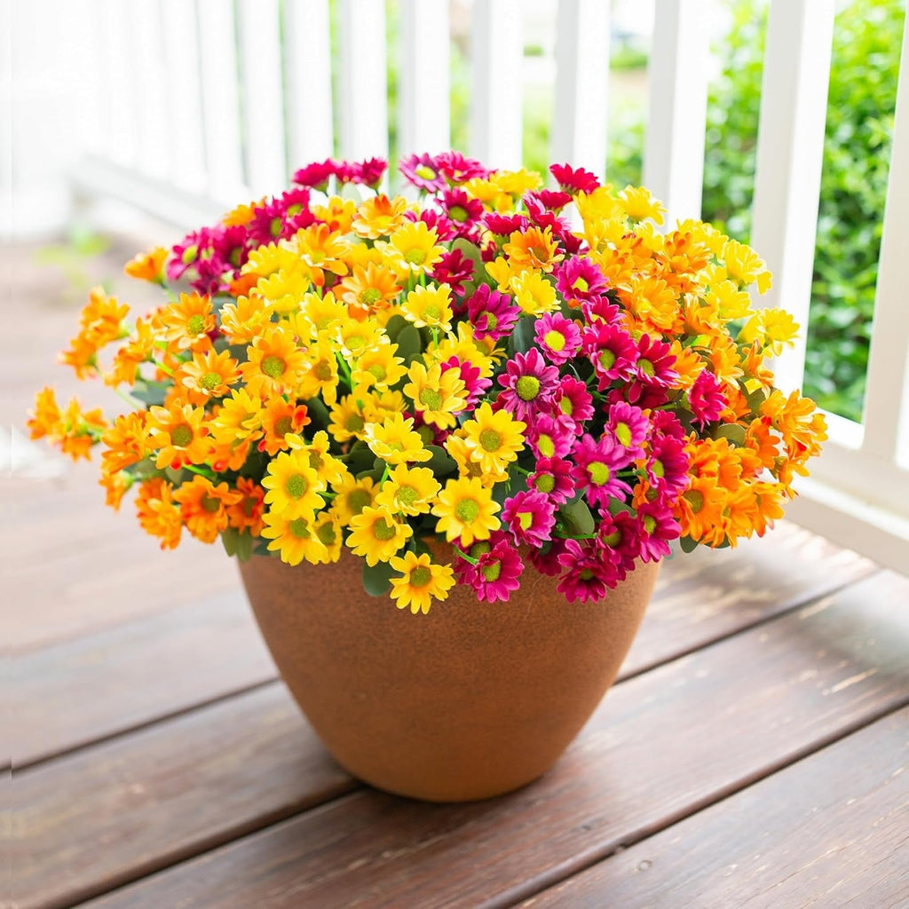 Potted plant with colorful flowers on a wooden deck