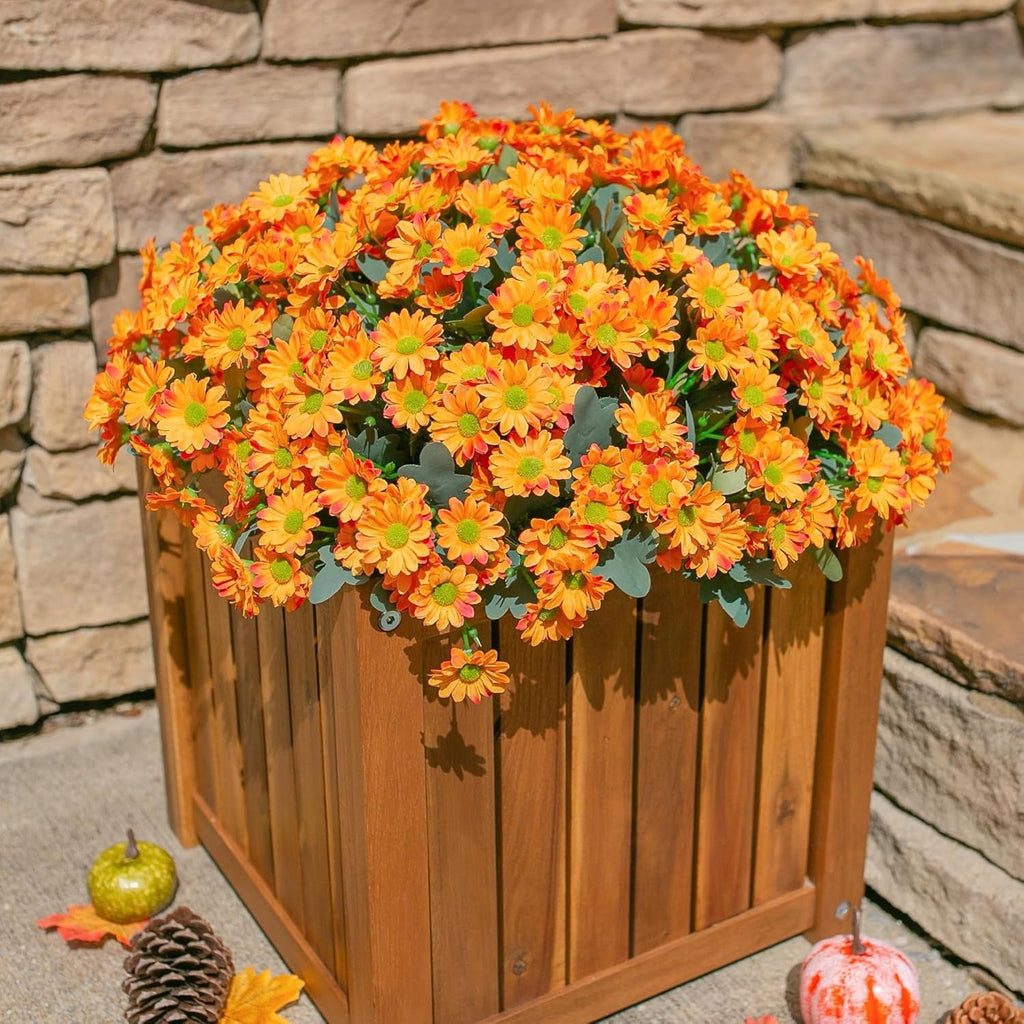 Wooden planter with orange flowers against a stone wall background
