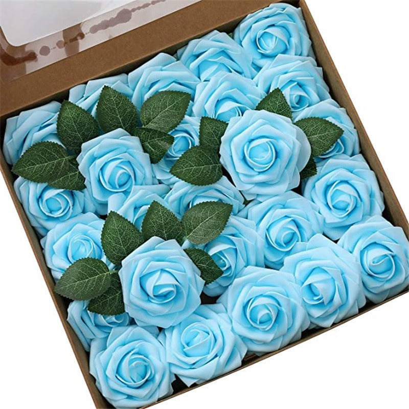 Box of blue roses with green leaves on a white background