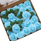 Box of blue roses with green leaves on a white background
