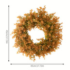 Artificial wreath with dimensions indicated on a white background