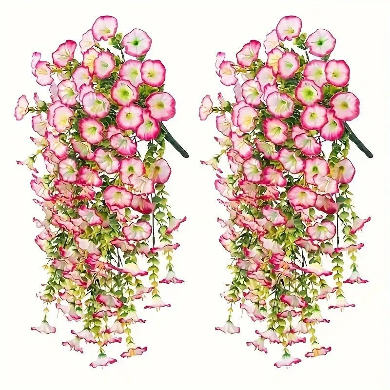 Two sets of pink and green artificial hanging flower arrangements on a white background