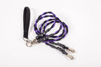 Black and purple braided lanyard with metal clasps on a white background