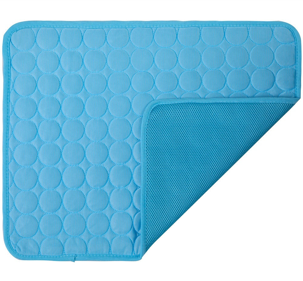 Blue quilted mat with textured surface on a white background