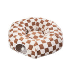 Checkered pet bed with brown and white pattern on a white background