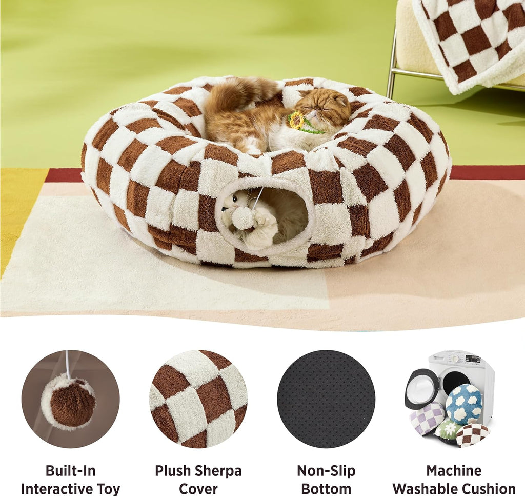 Checkered pet bed with plush sherpa cover, non-slip bottom, and built-in interactive toy on a green background.