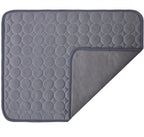 Gray quilted mat with circular pattern on a white background