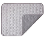 Gray quilted mat with textured surface on a white background