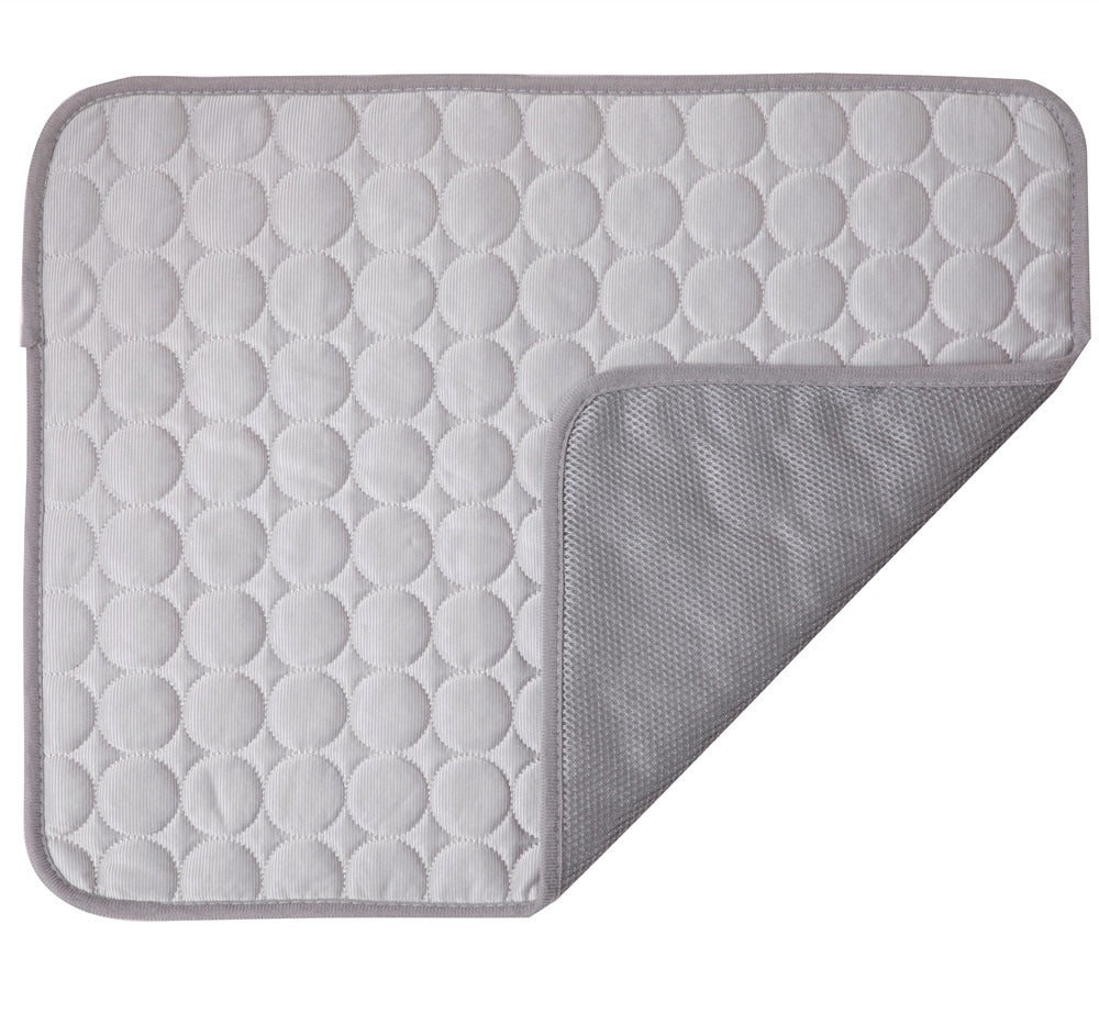 Gray quilted mat with textured surface on a white background