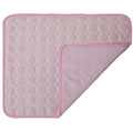 Pink quilted mat with a textured pattern on a white background