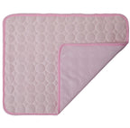 Pink quilted mat with a textured pattern on a white background