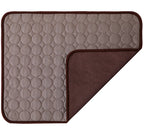 Two textured mats, one beige with circular pattern and one brown, on a white background.