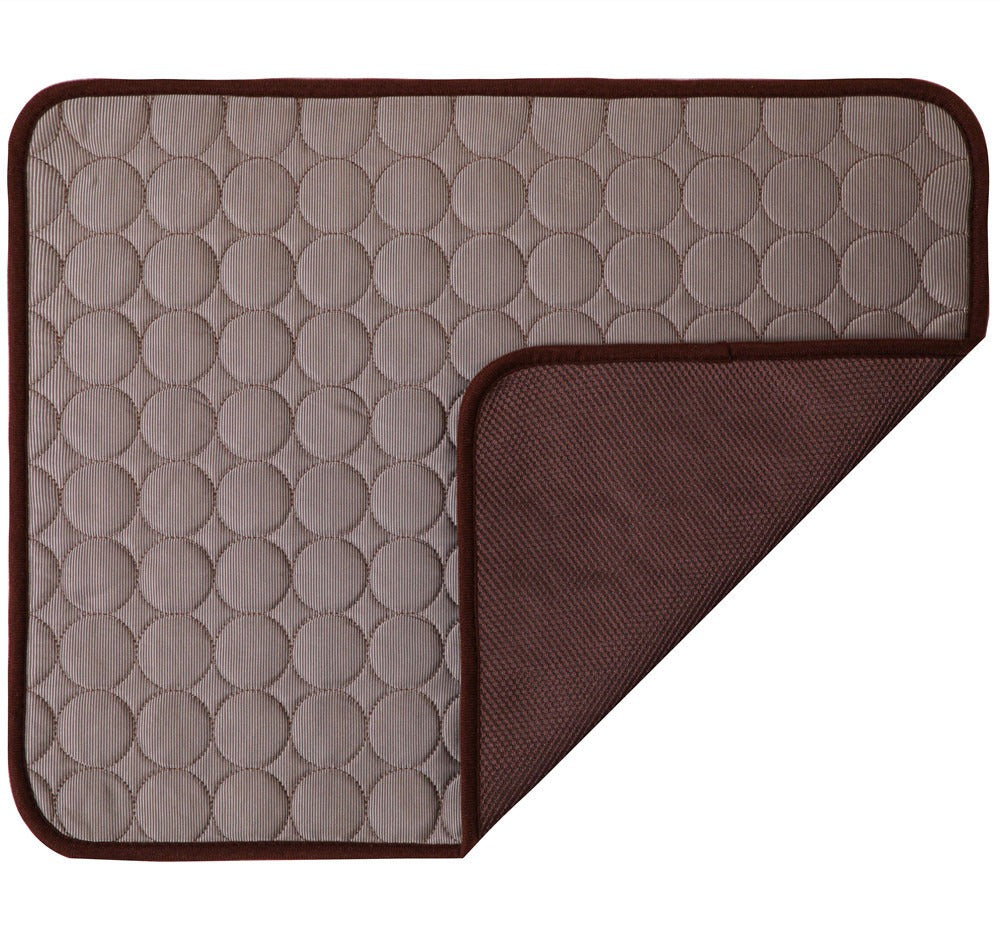 Two textured mats, one beige with circular pattern and one brown, on a white background.